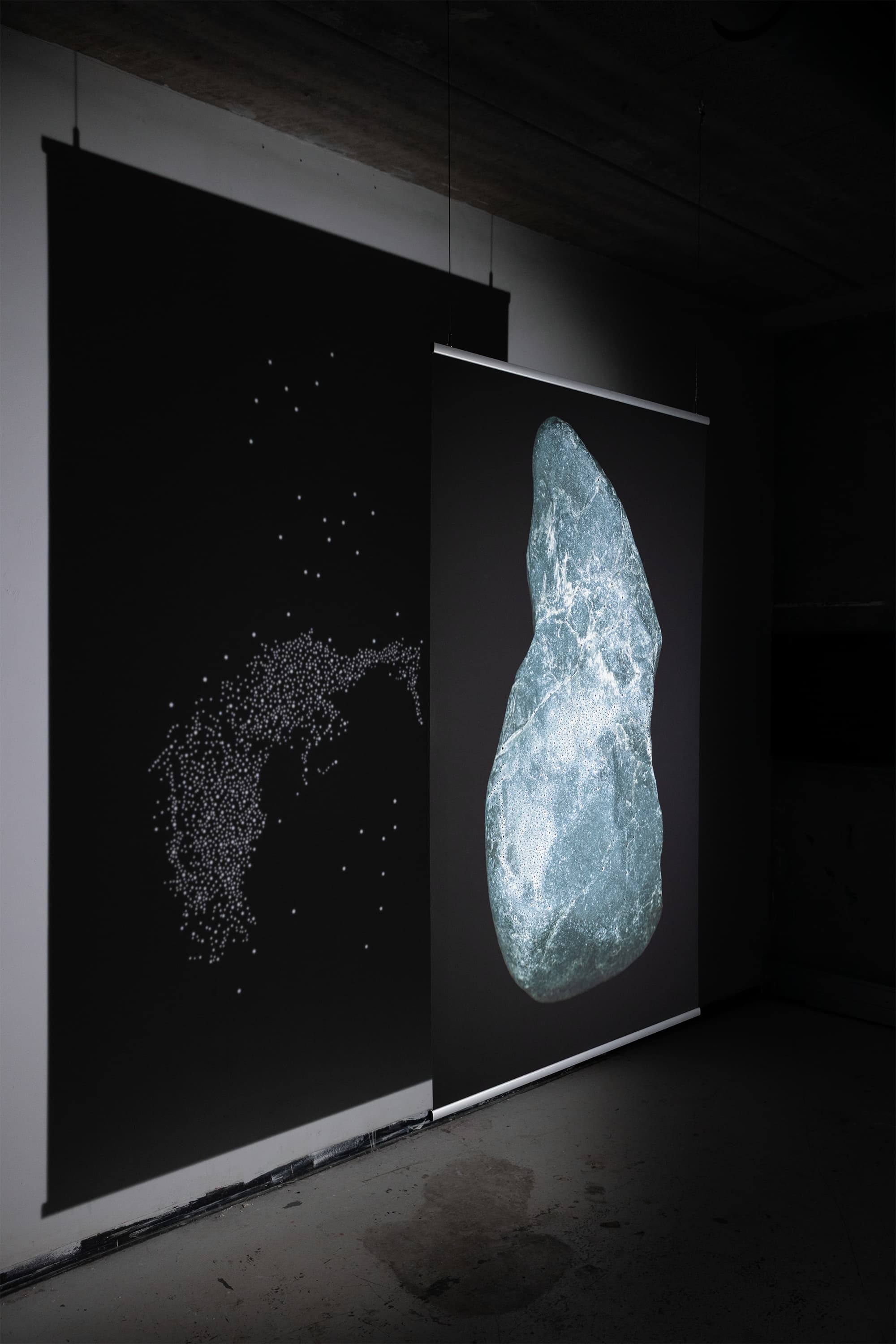 The image is a high-resolution digital scan of the surface of a stone collected along the Dora River in Turin, Italy. Printed at a large scale, it amplifies the visual experience of the traces emerging from the rock. These figures are considered acheiropoietic images—forms not made by human hands. The research draws on the practice of reading stones as a form of divination. The images revealed on the rock’s surface guide the divinatory act, activating the imagination and perceptual sensitivity of the seer.